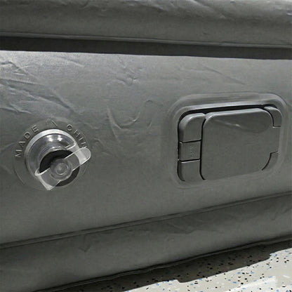 Portable inflatable bed partially folded illustrating compact and lightweight design