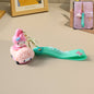 Close-up of cartoon silicone keychain with flexible strap on white background