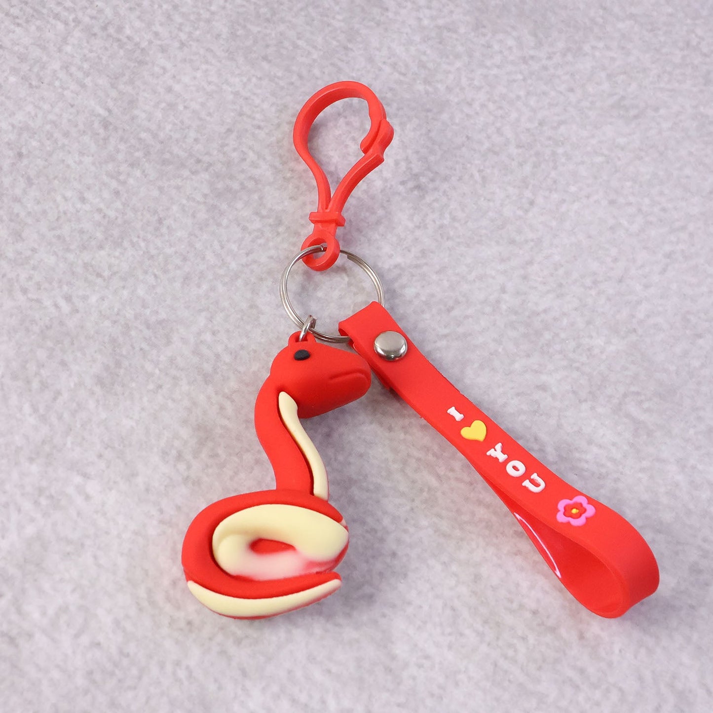 Side view of the cartoon snake keychain highlighting its compact design