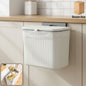 Wall mounted kitchen dustbin attached to cabinet door