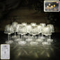 Crystal style LED table lamp with warm yellow glow on a table