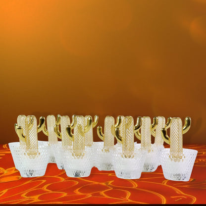 Close-up of decorative cactus LED tealight candle with warm glow