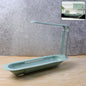 Telescopic sink storage rack holding sponges and brush