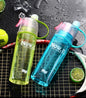 Blue 600ML Spray Water Bottle, ideal for staying hydrated during outdoor activities.