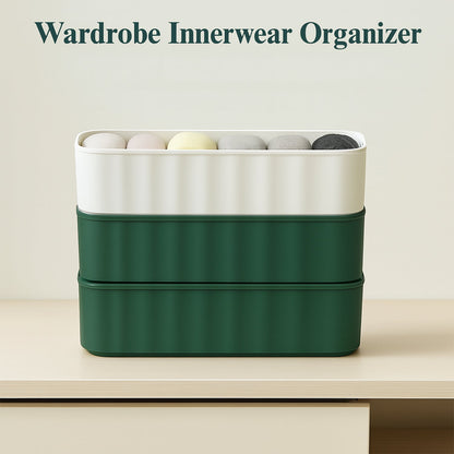 Angled view of four stackable 5-compartment drawer organizers, ideal for closets.