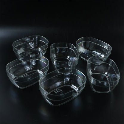 Oval clear serving bowls in use for presenting fresh salads
