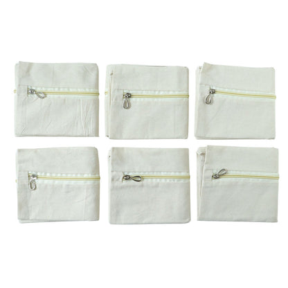 Six saree storage zipper pouches arranged for wardrobe organization