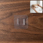 Clear self-adhesive wall hook for easy, tool-free mounting on smooth surfaces.