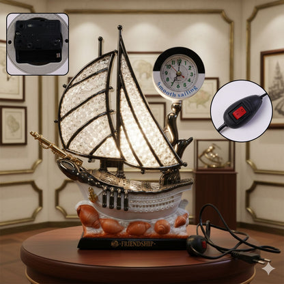 Analog clock on ship shaped decorative table lamp with warm LED