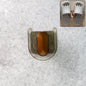 Transparent self-adhesive wall mount slipper holder showing U-shaped design