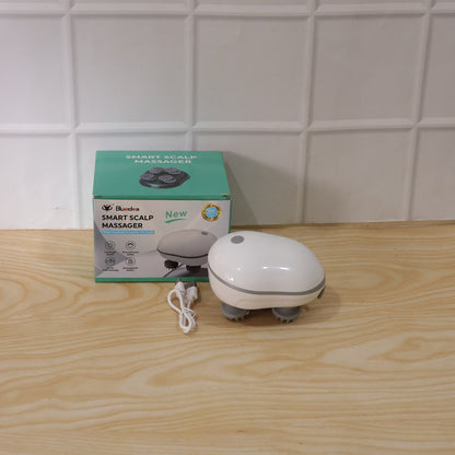 Person holding and demonstrating use of electric scalp massager