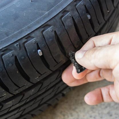 Close-up of pink tire repair nail plug