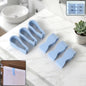 Multipurpose towel clips in use on a towel rod in a modern kitchen