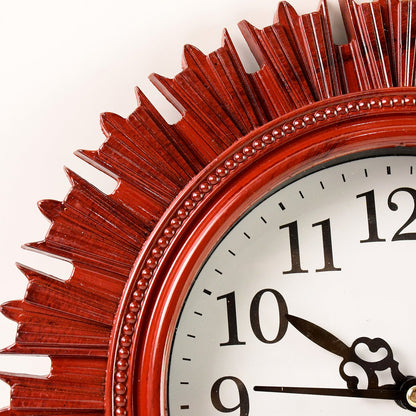 Side profile of the round wooden look wall clock, showcasing its slim design and plastic finish.