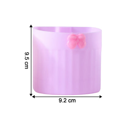Adhesive toothbrush holder stand attached to smooth bathroom wall