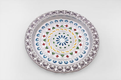 Decorative silver plated pooja thali with a polished finish, reflecting cultural heritage.