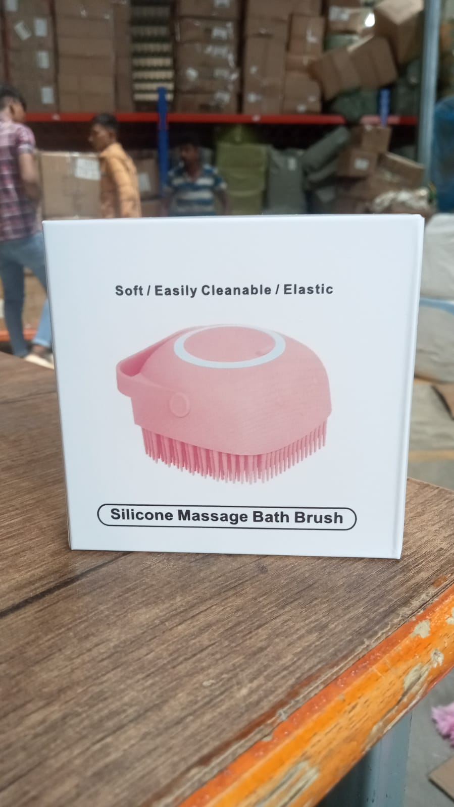 Silicone massage bath body brush featuring soft bristles and an easy-to-use shampoo dispenser.