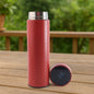 Red vacuum insulated water bottle with LED temperature display on top.