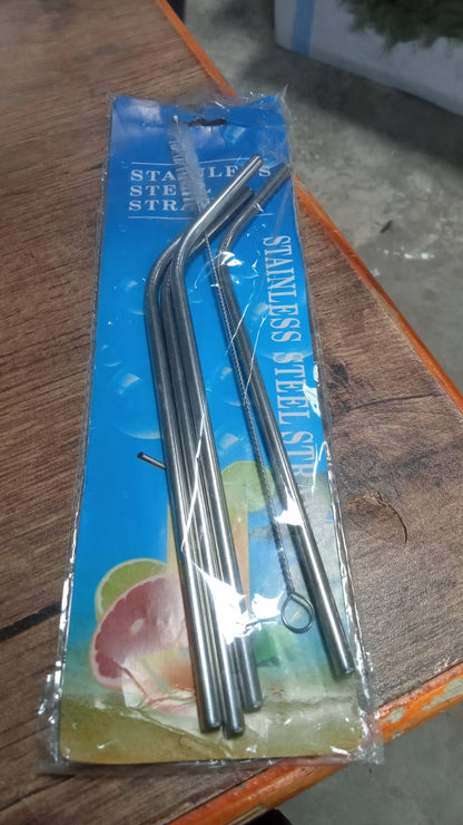 Hand holding a glass with an eco-friendly bent stainless steel straw, promoting sustainable living in India.