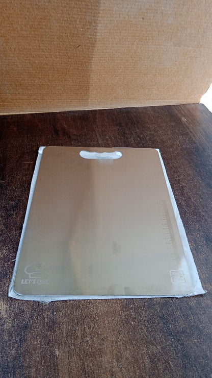 Durable stainless steel cutting board with handle, perfect for home kitchens