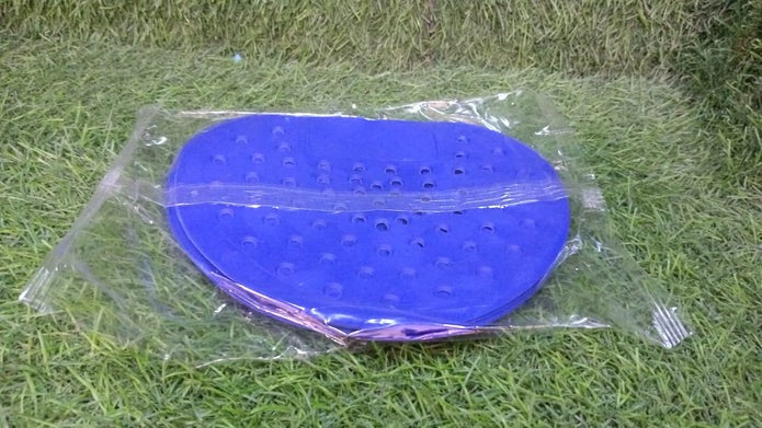 Urinal screen deodorizer placed in a clean public restroom.