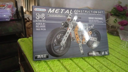 Kids enjoying the challenge of assembling the metal bike building blocks.