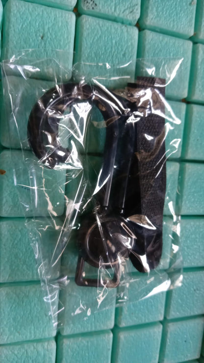 Stroller hook product showcasing its compact size and design.