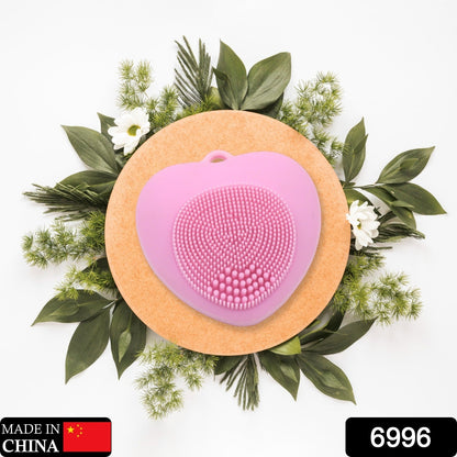 Heart-shaped silicone face wash brush for deep skin cleansing.