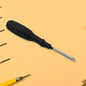 XcelGrip Phillips screwdriver with red and black handle, showing the cross-head tip.