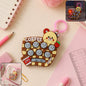 Unicorn fidget popper keychain toy with nine popper bubbles attached to a clip