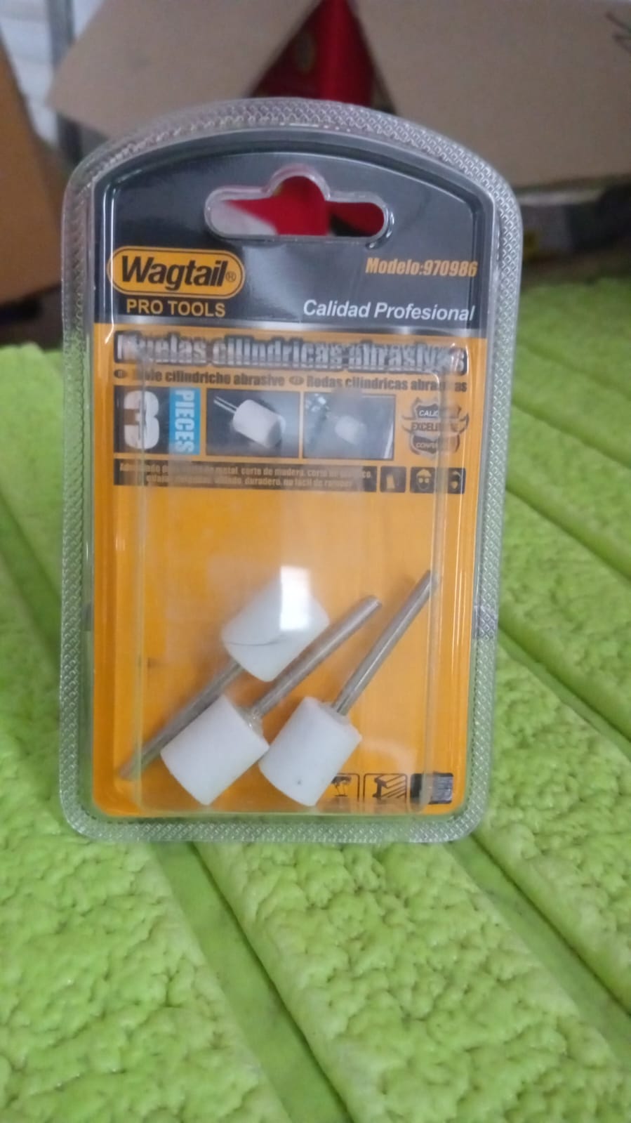 Detail of a wool felt polishing wheel effectively buffing a metal surface.