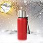 Silver stainless steel water bottle with leak-proof cap on a plain background.