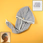 Woman demonstrating how to use a pink hair drying towel wrap from Calm & Curl.