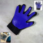 A five-finger pet deshedding glove with silicone tips, ready for grooming.