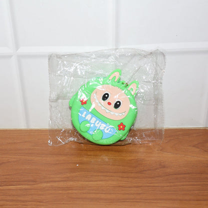 Cartoon coin pouch placed in a lifestyle setting showing portability
