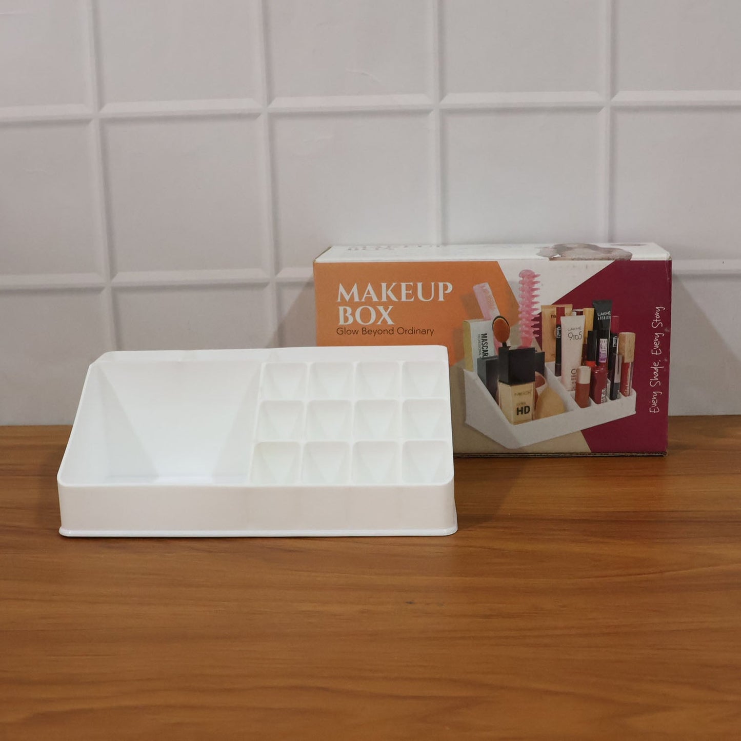 Lifestyle shot of the clear makeup organiser with brushes and lip products.