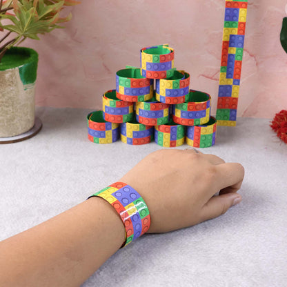 Various snap slap bracelets lined up with vibrant patterns